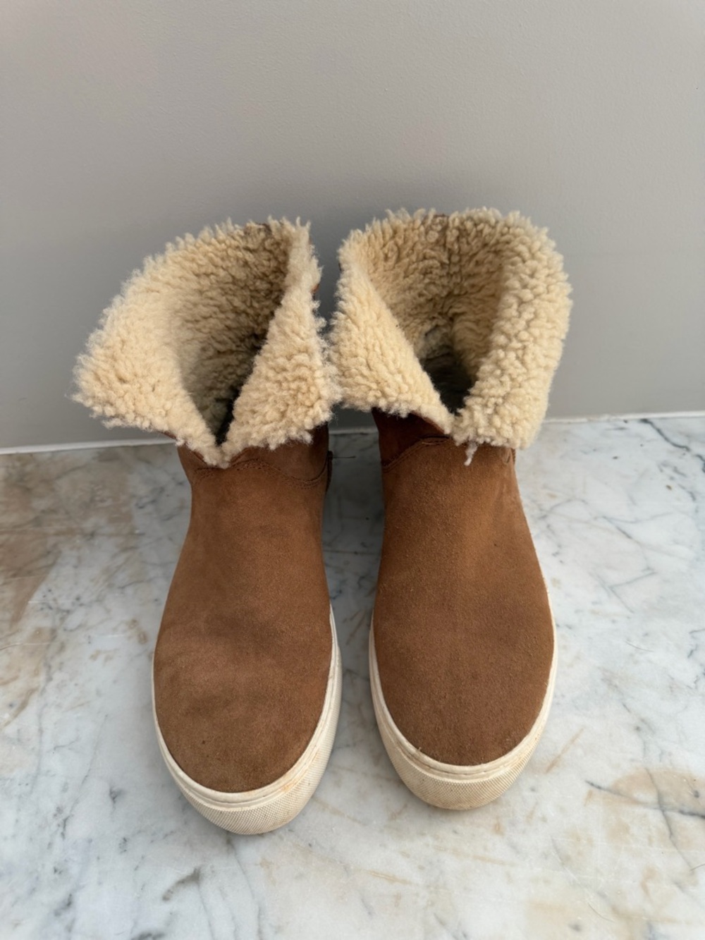 UGGS Ankle boots. These boots have a leather like sole on the inside